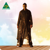 Cardboard cutout of a character in a dark raincoat on a colorful background with 'Australian Made' logo.